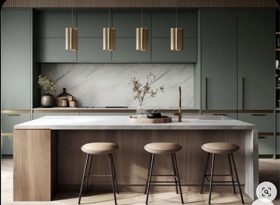 Sage green kitchen with brass pendants